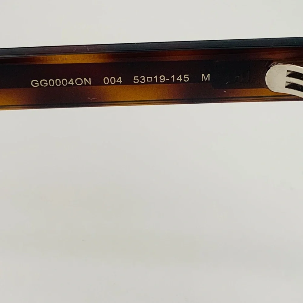 Gucci's GG0004ON features soft lines frames acetate front. Iconic web effect